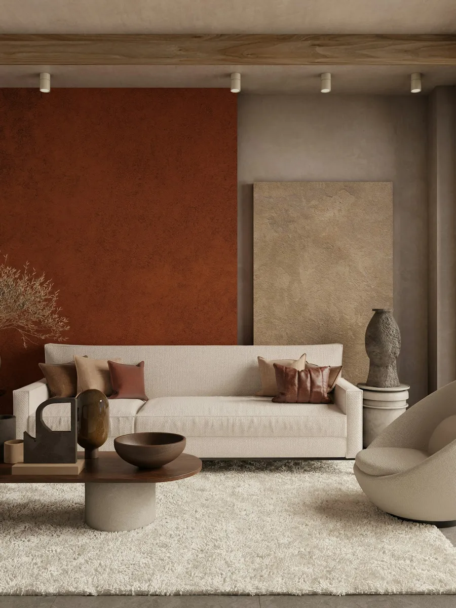Séjour aux tons terre : mur terracotta, plafond et menuiseries clairs